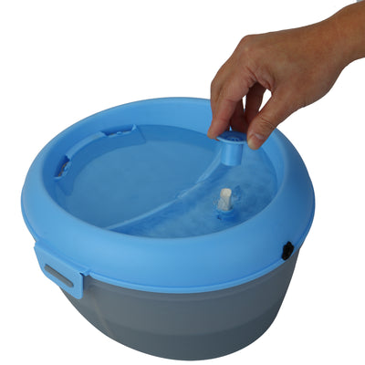 CoolerDog Healthspring pet fountain, blue/gray, , water running, with hand inserting dental stick