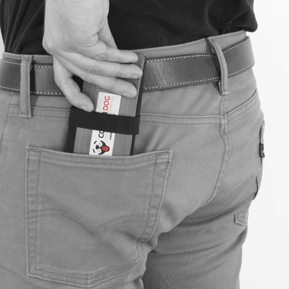 Man placing a folded up CoolerDog portable dog bowl in his back pocket